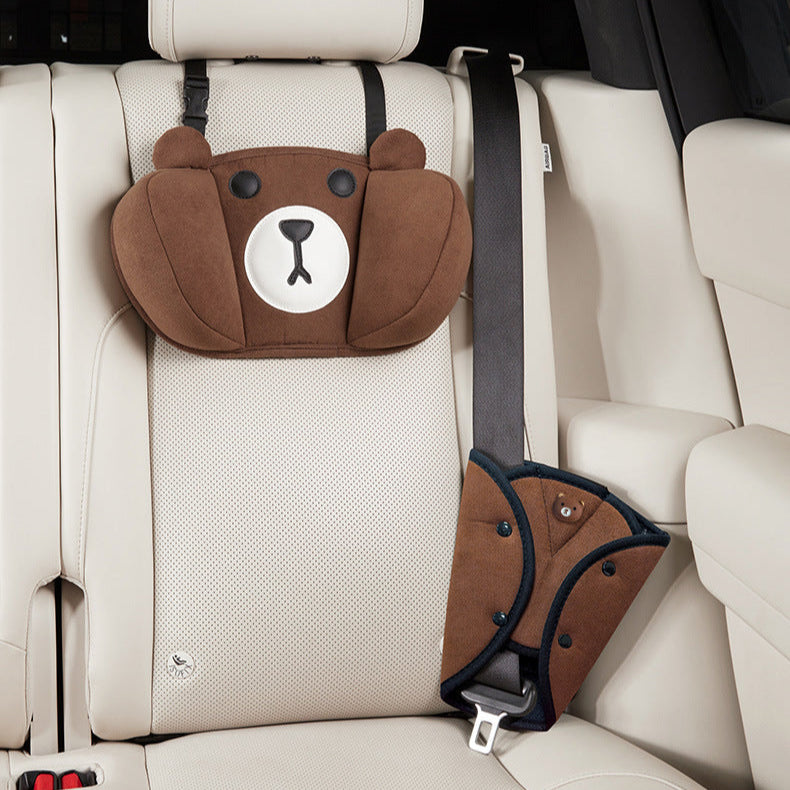 Children's car seat pillow and seatbelt cover set in brown bear design, providing comfort and safety in the car interior