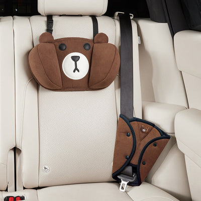 Children's car seat pillow and seatbelt cover set in brown bear design, providing comfort and safety in the car interior