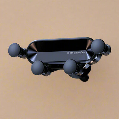 Black car phone holder with text 'Hi I'm Little One' on a beige background